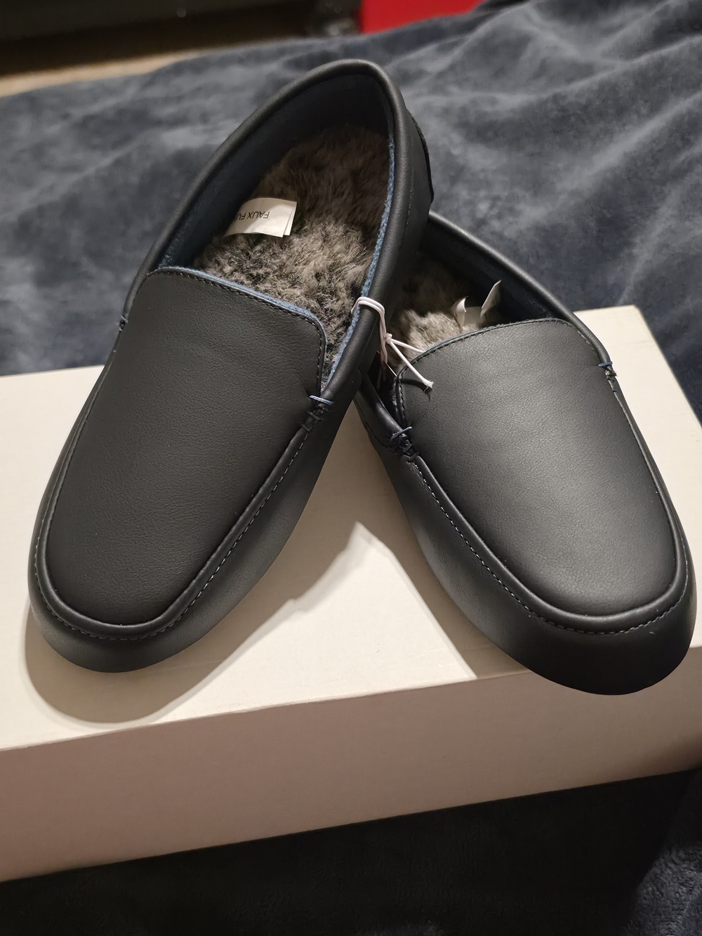 isotoner Black Women's Faux-Leather Fleece-Lined Moccasin Slippers